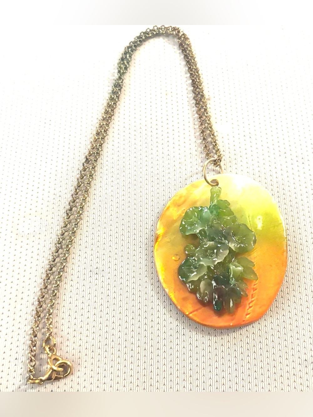 Gold-Tone Necklace with Orange Oval and Green Floral Accent